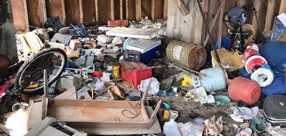 Photo of a garage full of junk