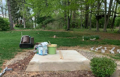 An empty concrete slab after shed demolition