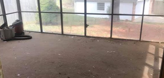 Cleared screen porch after furniture removal