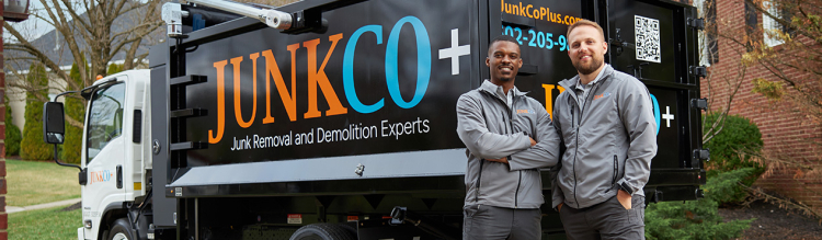 JunkCo workers standing in front of truck