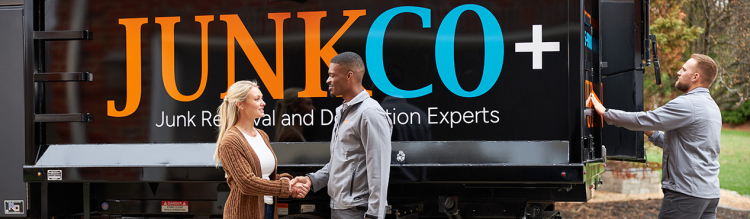 JUNKCO+ technician and customer in front of truck